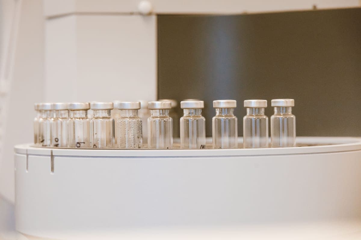 Glass test vials arranged on a bench