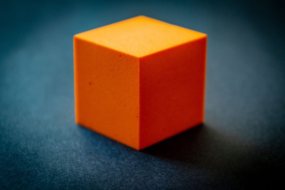 A block of filter foam on a dark surface
