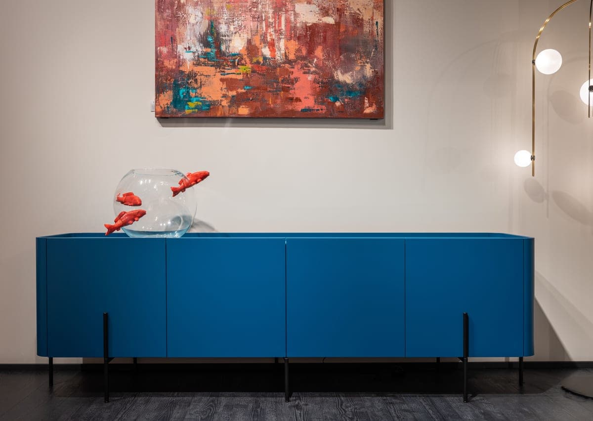 A glass aquarium built into cabinetry in a modern living room