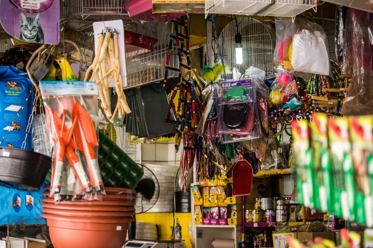 Pet shop shelves stocked with aquarium supplies and accessories
