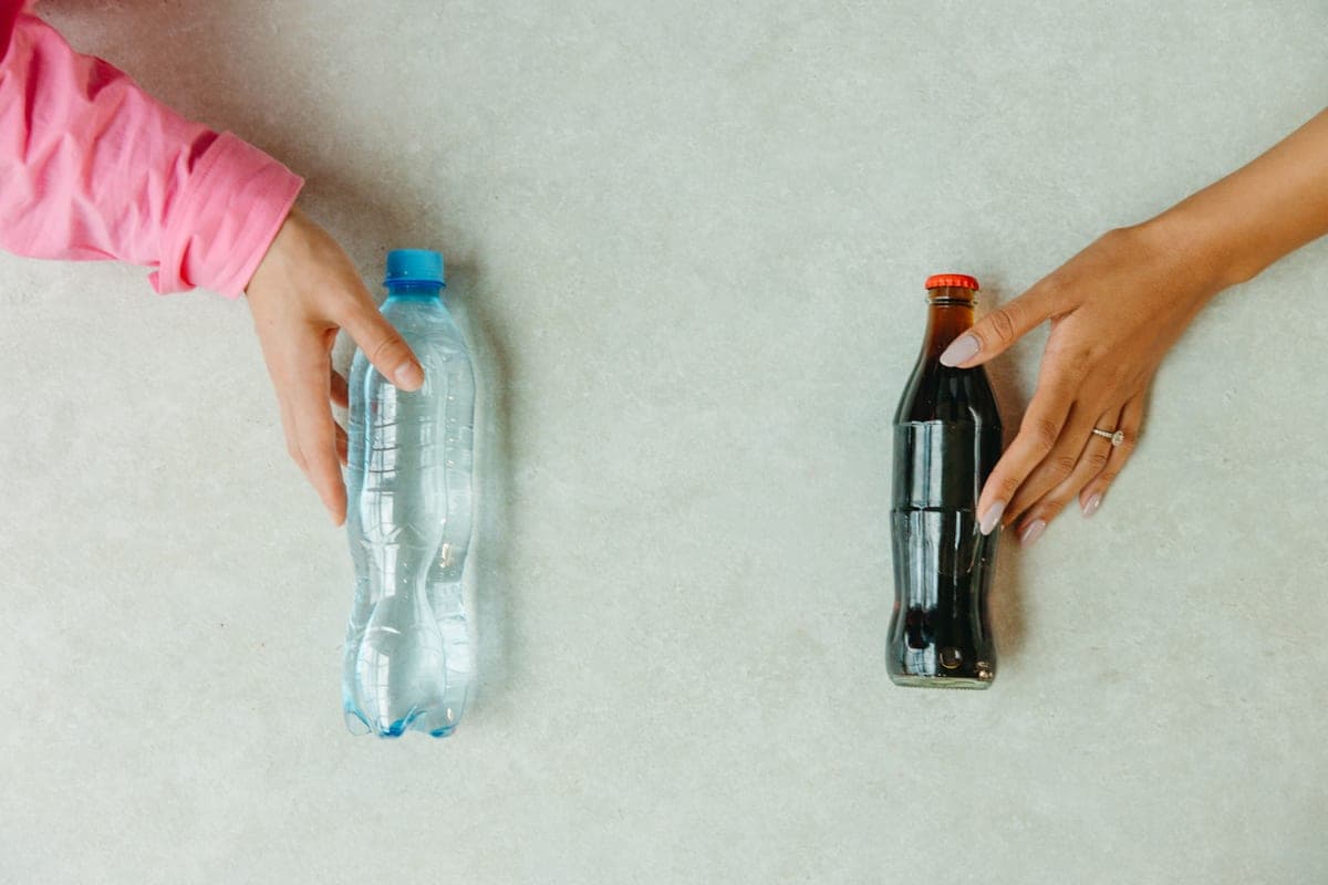 Two bottles of aquarium water treatment side by side